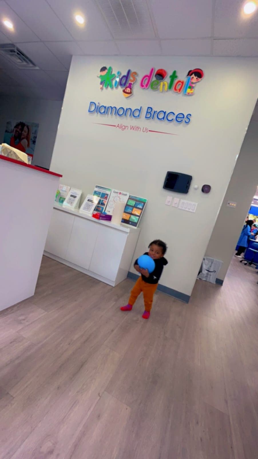 A little one heading in past our reception wall