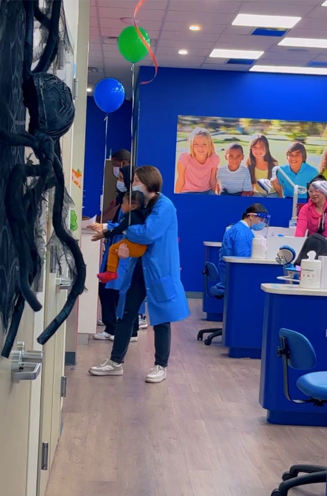 Our team welcoming a young patient in the front office